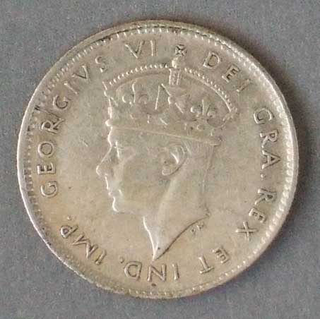 Color photo: Obverse view of 5 cent coin - Newfoundland 1947
