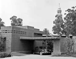 B/W photo: Car in driveway of Unisonian house