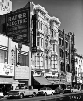 B/W photo of downtown business street - Embedded text: 1967