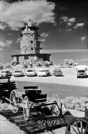 B/W infrared photo: Parking lots in front of round, stone tower - Embedded text: 9/29/72