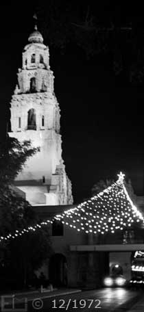 B/W photo: El Prado entrance to park at night; with Xmas lights - Embedded text: 12/1972