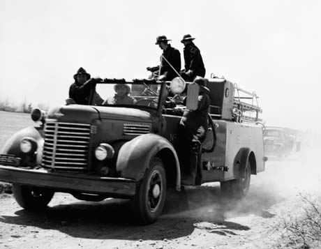 grayscale photograph: speeding firetruck