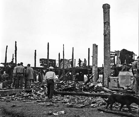 grayscale photograph: ruins of fire