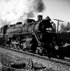 grayscale photograph: Steam Locomotive