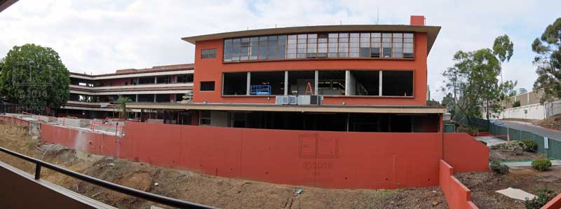 Wide curvilinear view of "A" building complex in early stage of demolishment