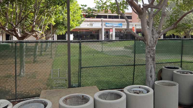 Front view of fenced off "D" and "A" buildings