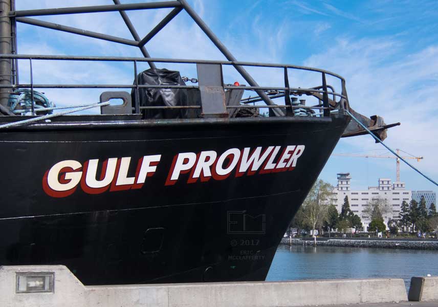 Fishing boat "Gulf Prowler" with NSC Broadway in distance accross water