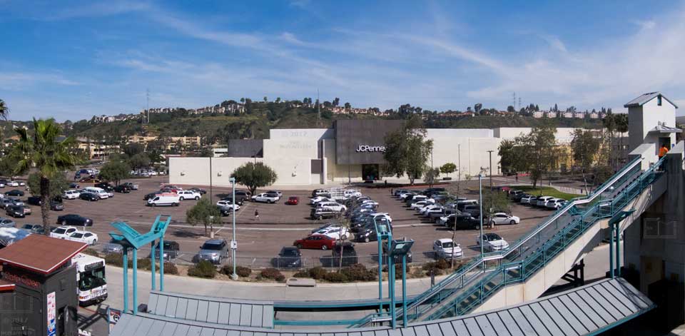 Wide view of Fashion Valley Transit Center, shopping center and surrounding area from elevated trolley platform