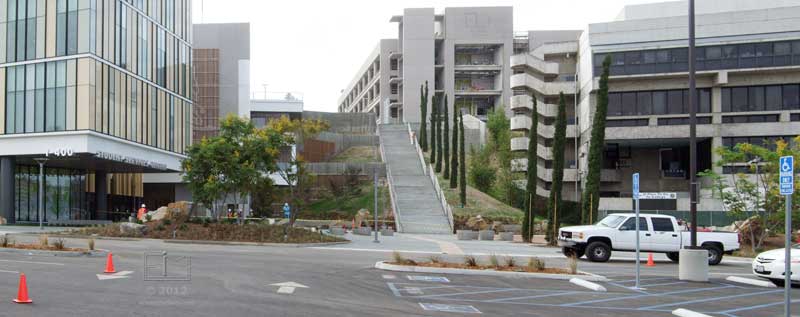 Wider view from parking lot of new staircase and surrouning buildings