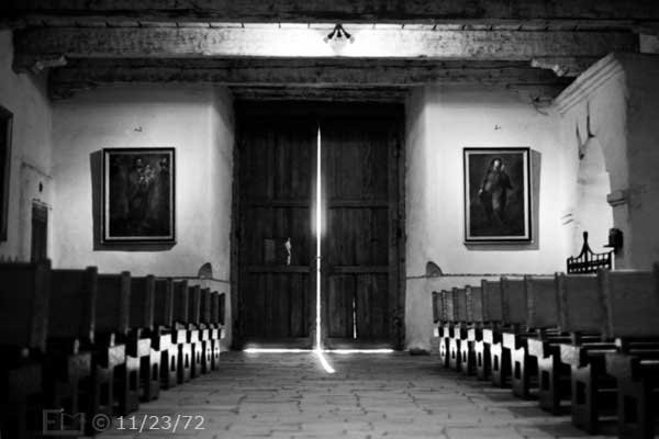 B/W photo: View of church interior looking towards front entrance doors - Embedded text: 11/23/72