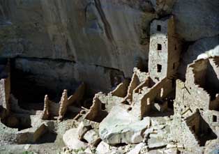 Color photo: Landscape view of Square Tower House Ruins from across canyon