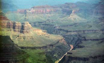 Color photo: Landscape view of Colorado River and its Grand Canyon surroundings