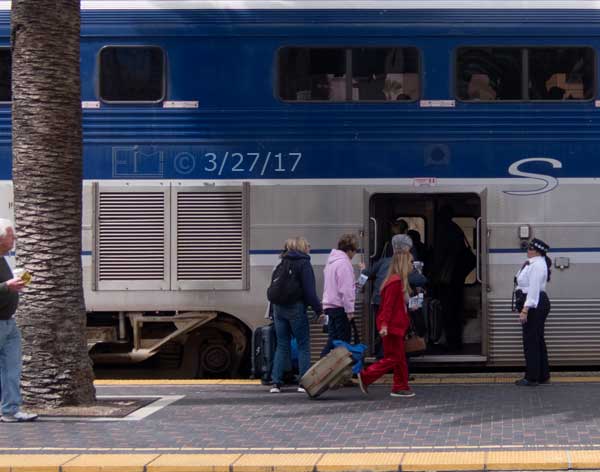 Color photo: Passengers boarding the Coaster train at Santa Fe station - Embedded text: 3/27/17