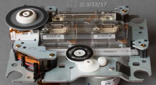 Color photo: Home DVD disc mechinism showing pick-up travel range - Embedded text: 3/22/17