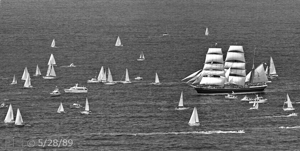 B/W photo: 'Star of India' sailing on ocean amid multiple spectator pleasure boats - Embedded text: 5/28/89