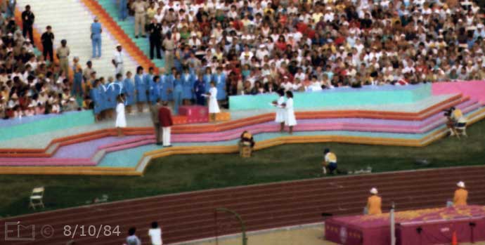 Color photo: Enlarged crop from previous image shows presentation being made  - Embedded text: 8/10/84