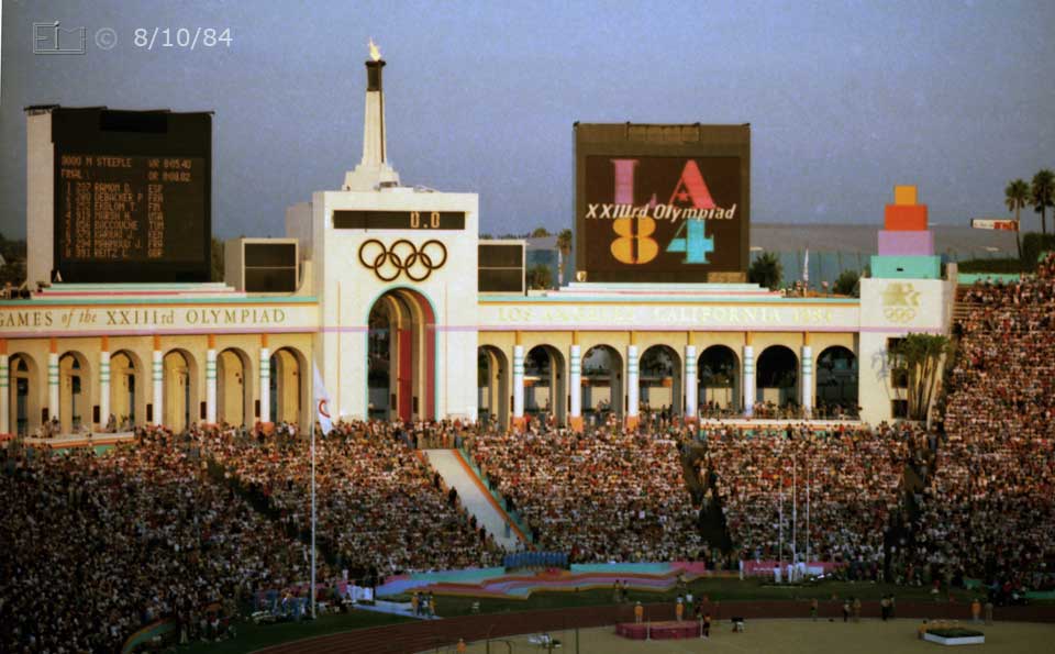Color photo: The sun setting on the Coliseum - Embedded text: 8/10/84
