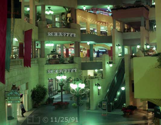 Color photo: Multiple levels of storefronts at Horton Plaza - Embedded text: 11/25/91