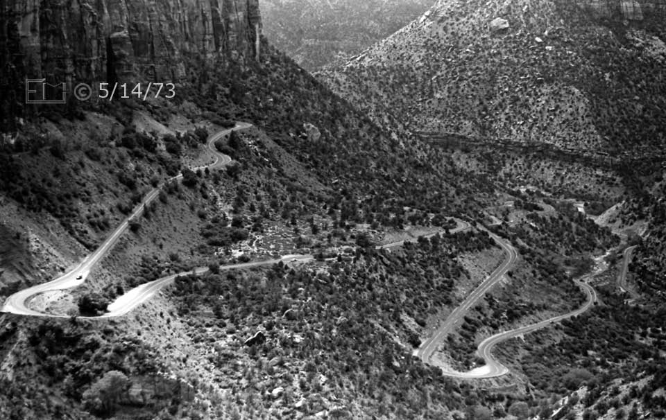B/W photo: Telephoto, landscape view of switch backed roadway - Embedded text: 5/14/73