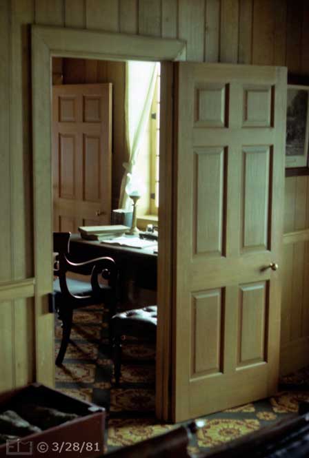 Color photo: Window lighted office  area viewed through doorway - Embedded text: 3/28/81