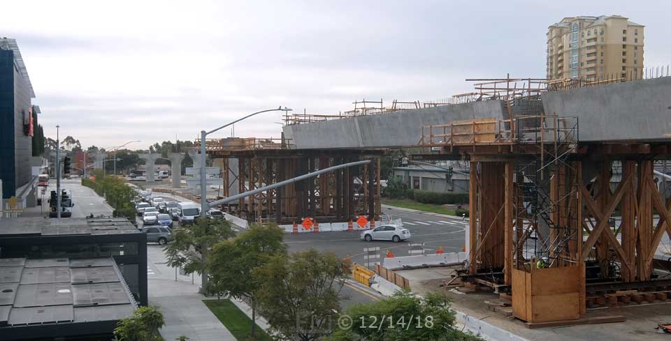 Color photo: Elevated view of Esplanade Ct/Genesee Ave entrance to UTC and trolley line construction - Embedded text: 12/14/18