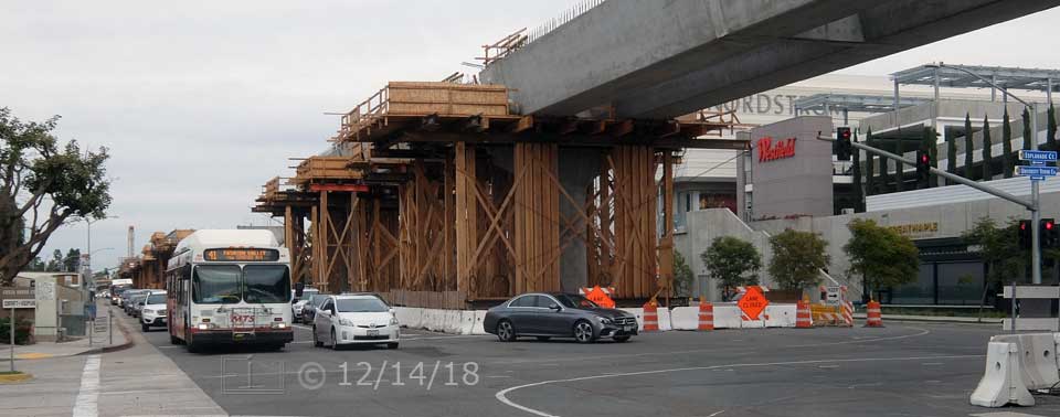 Color photo: Trolley line construction at Genesee Ave/Esplanade Ct intersection - Embedded text: 12/14/18
