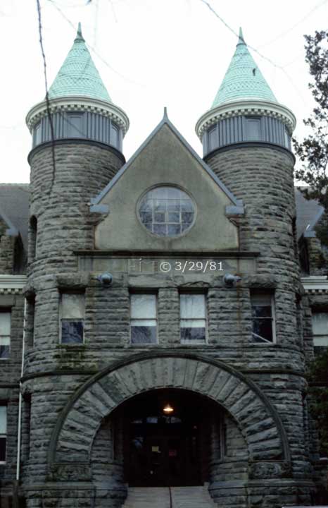 Color photo: Frontal view of entrance to stone building - Embedded text: 3/29/81