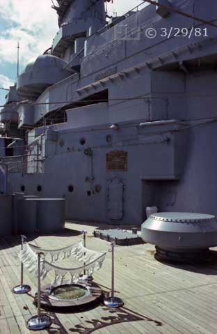 Color photo: Rear looking view of surrender plaque and ship's superstructure - Embedded text: 3/29/81