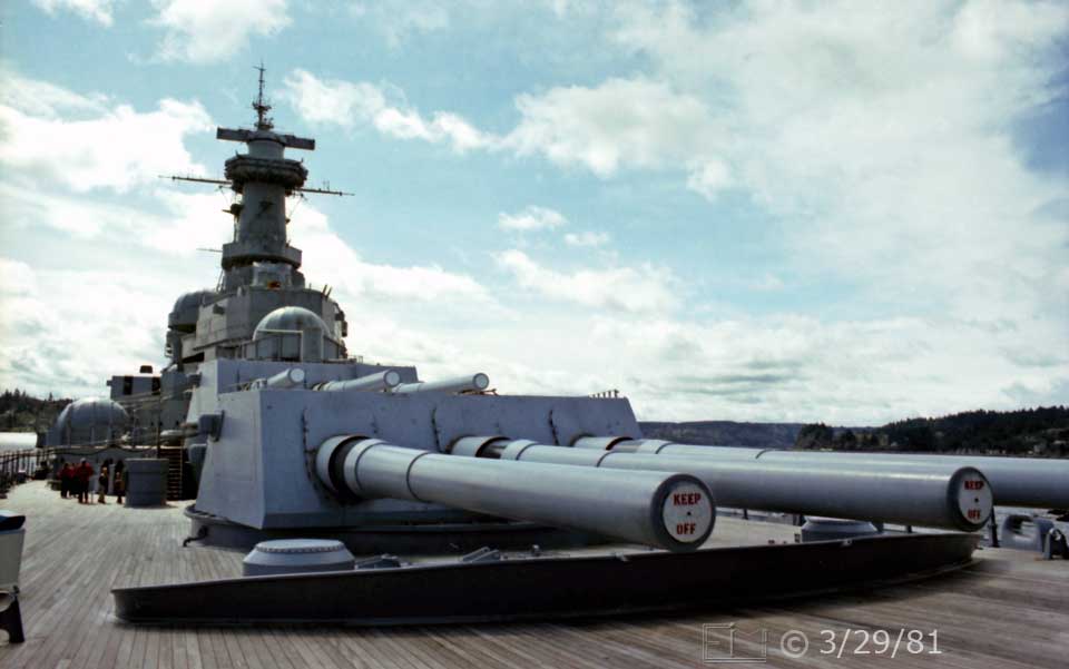 Color photo: Frontal view forward gun turret and wooden deck - Embedded text: 3/29/81