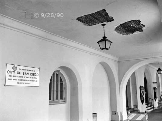 B/W photo: Damaged ceiling area on the west side of the House of Hospitality - Embedded text: 9/28/90