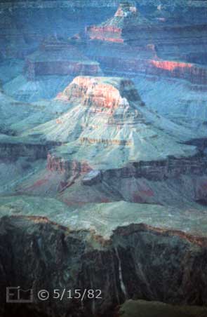 Color photo: Portrait, evening view of Cheops Pyramid with canyon wall in foreground - Embedded text: 5/15/82