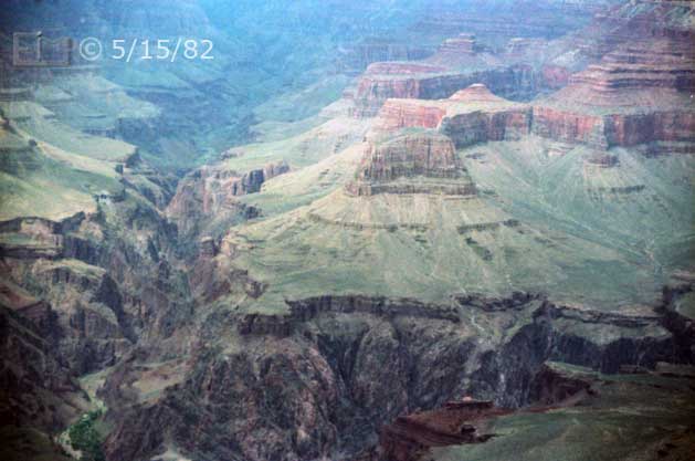 Color photo: Landscape view of Bright Angel Canyon, Sumner Butte and other Grand Canyon rock formations - Embedded text: 5/15/82