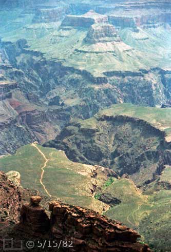Color photo: Elevated wide-angle view of hiking trail to Plateau Point and its surroundings - Embedded text: 5/15/82