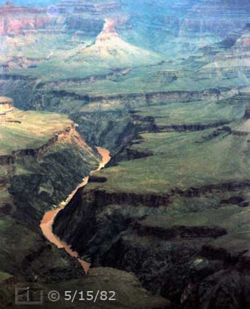 Color photo: Portrait view of Colorado River and its Grand Canyon surroundings- Embedded text: 5/15/82