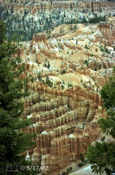 Color photo: Repeating rock walls in foreground of chaotic eroded rock landscape - Embedded text: 5/17/82