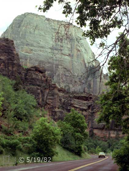 Color photo:  Highway traffic dwarfed by monumental landscape - Embedded text: 5/19/82