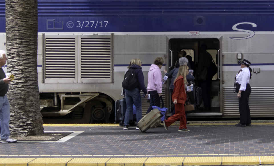 Color photo: Passengers boarding the Coaster train at Santa Fe station - Embedded text: 3/27/17
