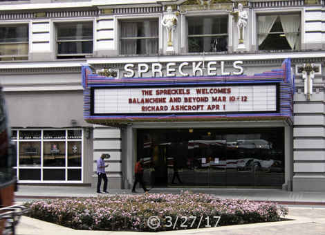 Color photo:  Device savvy pedestrians walking by the Spreckels Theater - Embedded text: 3/27/17