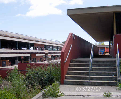 Color photo: View of a north side stairway entrance to City College, unkempt while construction underway - Embedded text: 3/27/17
