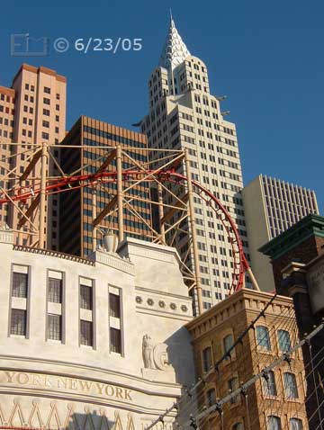 DSC color photo: Upward looking view of NYNY skyline and rollar coaser rails - Embedded text: 6/23/05