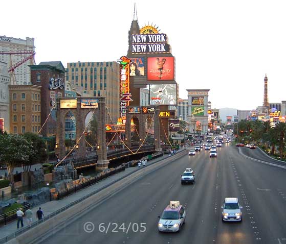 DSC color photo: Twilight view of Las Vegas Blvd, looking north, with NYNY on left; from Tropicana Blvd pedestrian overpass - Embedded text: 6/24/05