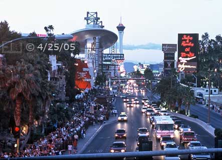 Film color photo: Pedestrian overpass view looking north, of Las Vegas Blvd with Treasure Island and Fashion Valley Mall on the left  - Embedded text: 4/25/05