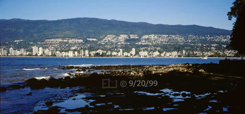 Color photo: A panoramic view of North Vancouver from Stanley Park - Embedded text: 9/20/99