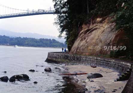 Color photo: Stanley Park Seawall/Shore with Lions Gate Bridge in distance - Embedded text: 9/16/99