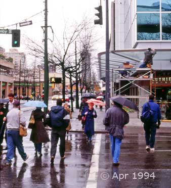 Color photo: Pedestrians crossing Downtown Street in crosswalk - Image taken: 4/7~12/1994