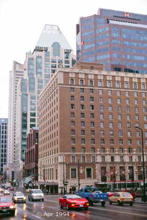 Color photo: Street traffic and buildings of downtown Vancouver - Image taken: 4/7~12/1994