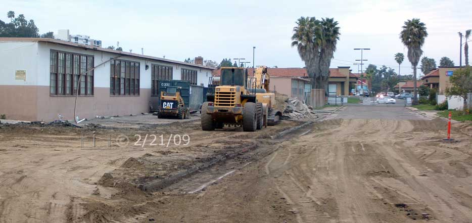 Color photo: View, looking north, of east side of old building - Embedded text: 2/21/09