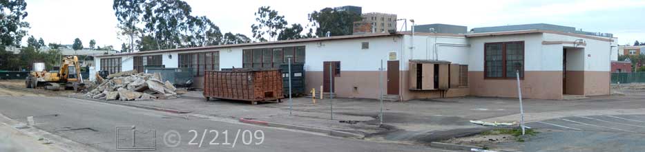 Color photo: Wide view of old buildings east and north sides - Embedded text: 2/21/09