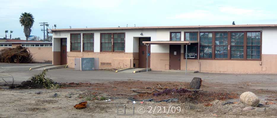 Color photo: Diagonal view of remaining old West City Center building, west side, north end- Embedded text: 2/21/09