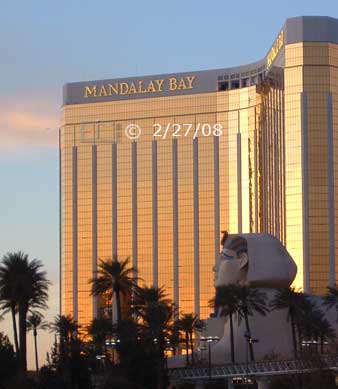 DSC color photo: Sunrise view of Luxor statue in foreground with Mandalay Bay in background  - Embedded text: 2/27/08
